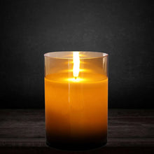 Flameless LED pillar candle in amber glass with a steady flickering LED flame.