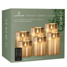Retail box showing a set of 6 flameless LED pillar candles in amber glass with remote.