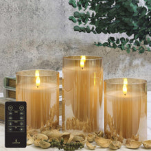 Flameless LED pillar candles in amber glass with glowing flames, styled with decor and remote.
