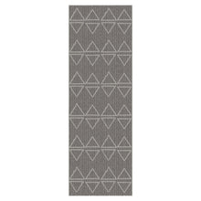 Grey runner rug with repeating triangle and chevron pattern, vertical rectangle