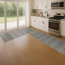 Grey runner rug with repeating geometric triangle pattern