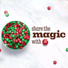 Bowl of red and green M&Ms milk chocolate candies with “share the magic” text