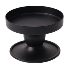 Black flippable candle holder with wide round top and pedestal base