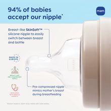 Anti-colic baby bottle close-up, clear nipple and matte white body with taupe collar