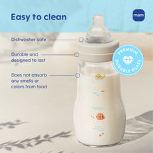 Clear glass baby bottle with mint rim, cream collar, animal splash print, 9 oz