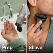 Electric foil face shaver in use with power shave gel tube