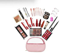 Makeup kit assortment with eyeshadow palettes, lip products, mascara, eyeliner, brushes, and pink pouch