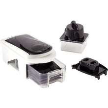 Vegetable chopper and slicer with white base, black lid, and slicing inserts