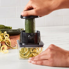 Vegetable chopper and slicer for zucchini slices in a clear container
