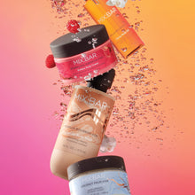 MIX:BAR body scrub jars with black lids, arranged with splash and small droplets