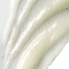 Thick white exfoliating scrub texture with small granules