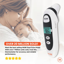 Infrared thermometer near baby with LCD temperature readout and scan controls