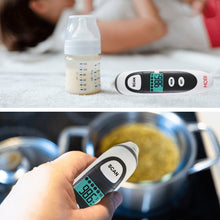 Handheld infrared thermometer with LCD display and scan button for temperature checks