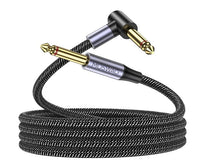 Black braided electric guitar instrument cable with gold 6.3mm plugs, coiled.