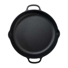 Black cast iron frying pan with two loop handles, round skillet