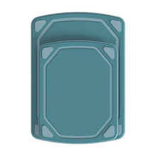Non-slip blue cutting board with textured surface, octagonal edge