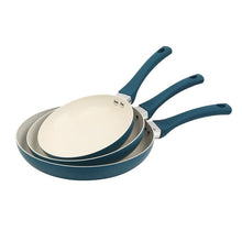 Set of 3 nonstick frying pans with teal exterior, cream interior, and arched handles.