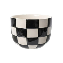 Round ceramic planter with glossy black-and-white checker pattern