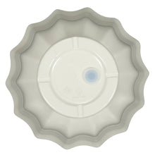Light gray fluted round planter bottom with scalloped rim and central drain hole