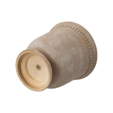 Ceramic urn planter pot, angled view, textured beige with drainage opening