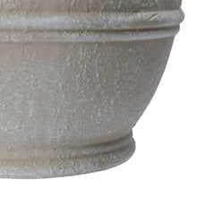 Cream ceramic planter with wave-embossed band and speckled textured surface