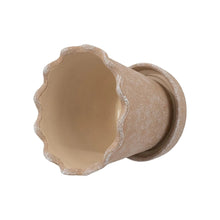 Wave ceramic planter with speckled terracotta exterior and cream inner bowl
