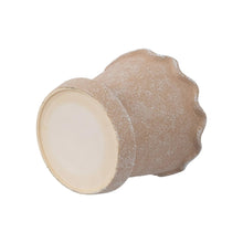 Wave ceramic planter with speckled terracotta glaze and cream round opening