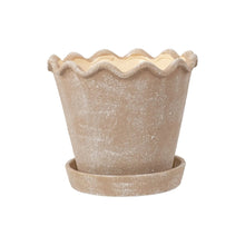 Tall wave ceramic planter with speckled beige-tan glaze and fluted top