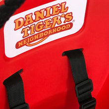 Red swing seat with Daniel Tiger's Neighborhood logo and black hanging straps