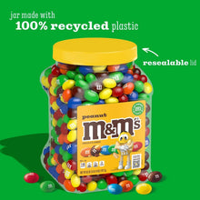 Peanut M&M's chocolate candy jar, yellow lid, filled with multicolored peanut candies