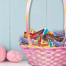 Woven Easter basket filled with assorted candy bars and wrapped sweets
