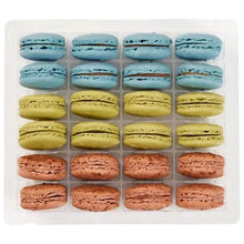French macarons assortment tray with blue, yellow, and pink filled cookies