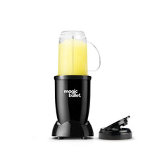 Black personal blender base with clear blending cup, handle, and spare lid