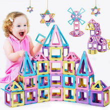 Magnetic building blocks set with pastel colorful houses and star shapes stacked play tower
