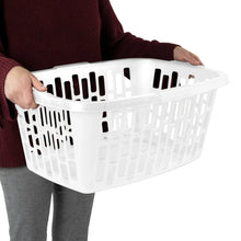 White rectangular laundry basket held by a person wearing a maroon top