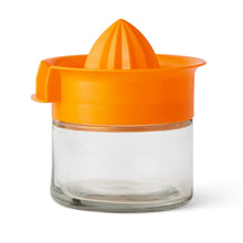 Orange citrus juicer with glass cup and screw-on top, including reamer