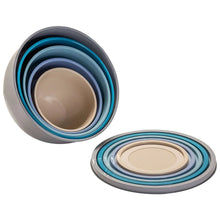 Stack of nesting plastic mixing bowls with assorted lids, teal, blue, and gray