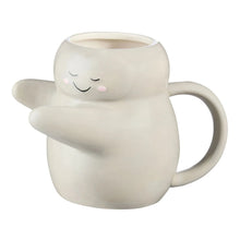 Cream sculpted hug earthenware mug with smiling face and rounded handle