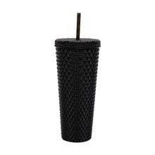 Black textured plastic insulated tumbler with straw, cylindrical diamond surface.