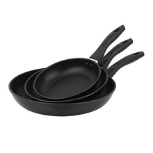 Black nonstick aluminum skillet set with three pans and riveted handles, side view
