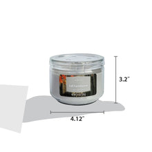 Scented 3-wick candle in clear glass jar with size markers