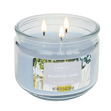 Unlit blue 3-wick glass jar candle with Beachside Linen label, 11.5 oz