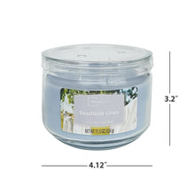 Top view blue glass jar candle with Beachside Linen label and lid vents