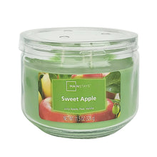 Green 3-wick glass jar candle with clear lid and printed label