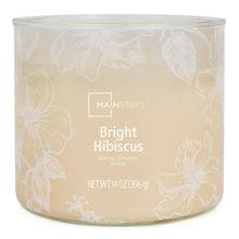 Amber scented candle in clear glass jar with white floral pattern