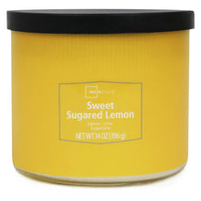 Yellow 3-wick candle jar with black lid closed and product label