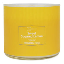 Yellow 3-wick candle jar with lid off, showing smooth wax top