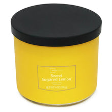 Yellow candle jar with black lid closed