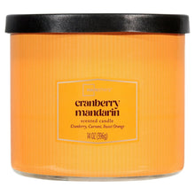 Textured amber jar candle with black lid, cranberry mandarin label