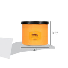 Amber candle jar with black lid, 4 in wide and 3.5 in tall